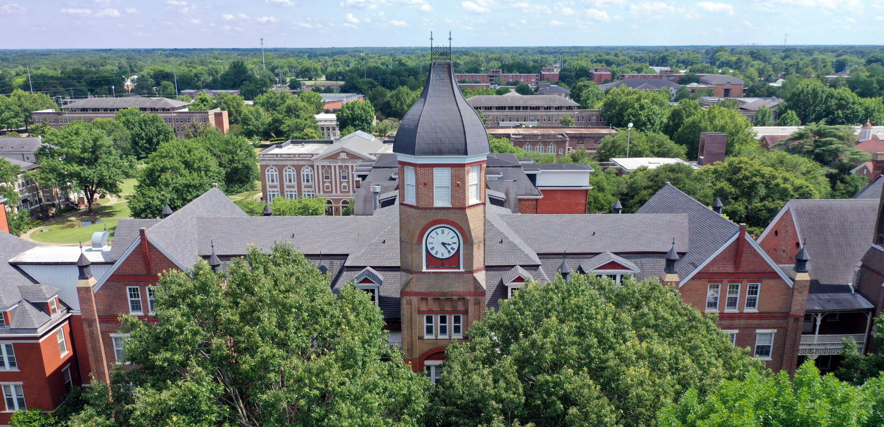 An aerial view of campus with the clocktower in the middle.
